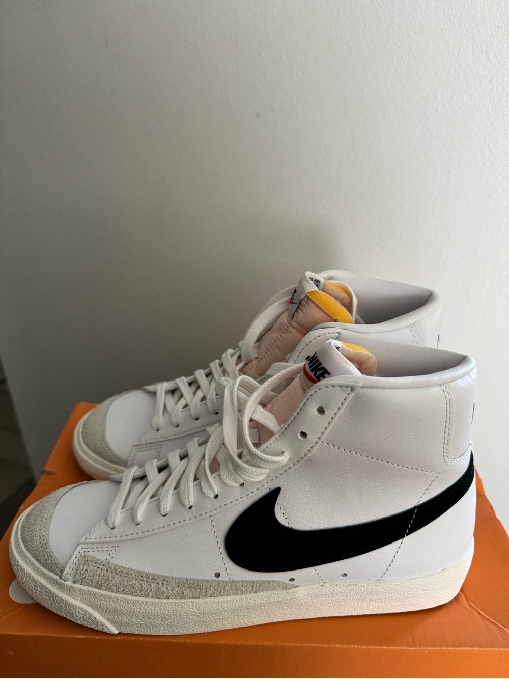Nike Men’s White High-Top Sneakers with Black Swoosh and Yellow Tongue